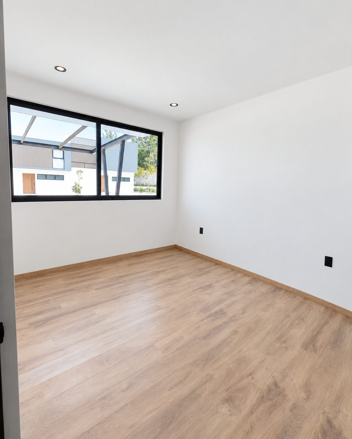 Secondary bedroom with large window and natural light · Casa Magna, builder in Morelia